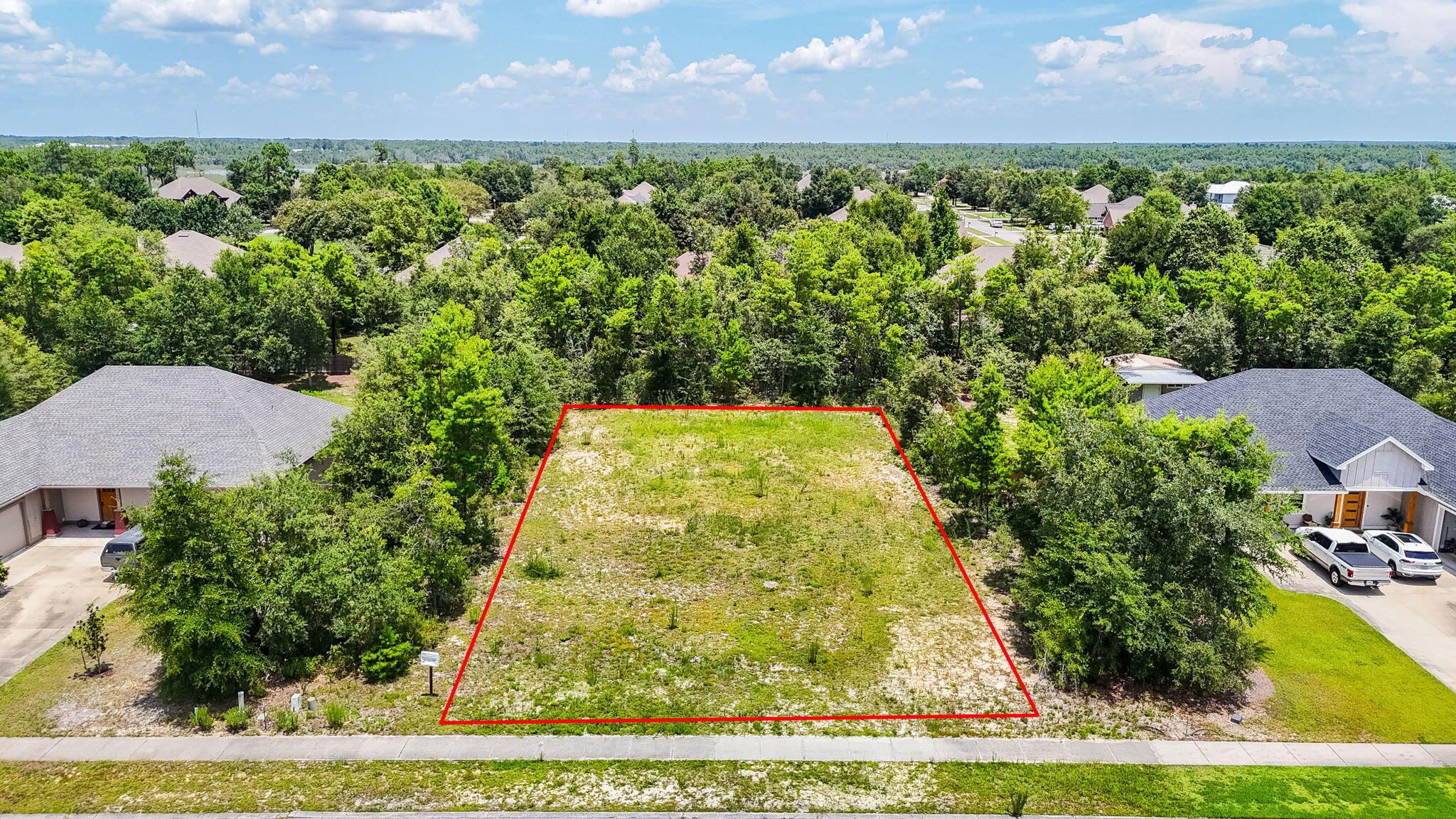 Live surrounded by trees, play all day by the lake - your dream home awaits in the gated community of Lake Merial, a 300-acre spring fed lake with amenities and a lifestyle you deserve! Nestled on 0.57 acres, this beautiful parcel has been cleared and is ready for build on. This homesite offers the perfect blend of privacy, nature, and possibility for you to build your dream home. At Lake Merial, you'll enjoy a sense of serenity that feels miles away--yet you're still a short drive to it all. Just a few minutes to grocery stores, shopping and more. This lake community exudes relaxation, southern charm and plenty of room from your neighbor while still having that community feel many desire. Whether you're dreaming of a modern lake retreat or a timeless family home surrounded by trees, this homesite is a blank canvas ready to bring your vision to life. Imagine the possibilities of your own private pool, a charming garden to grow your own vegetables, a garage for all the toys, and a place you can spread your wings and enjoy being home.
Life at Lake Merial is about more than just a place to live, it's a lifestyle. Enjoy gated security, picturesque walking trails, and access to a stunning 300-acre spring-fed lake perfect for fishing, kayaking, paddleboarding, or simply soaking in the natural beauty.
With expansive green spaces and a strong sense of community, Lake Merial offers the ideal mix of peaceful living and convenient access to Panama City, Lynn Haven and Panama City Beach, and everything in between. The Northwest Florida Beaches International Airport is a short 19 minute drive allowing easy access for those who need transportation for work or love to travel.
Come walk the lot, breathe in the quiet, and imagine what's possible. Your dream home starts here.