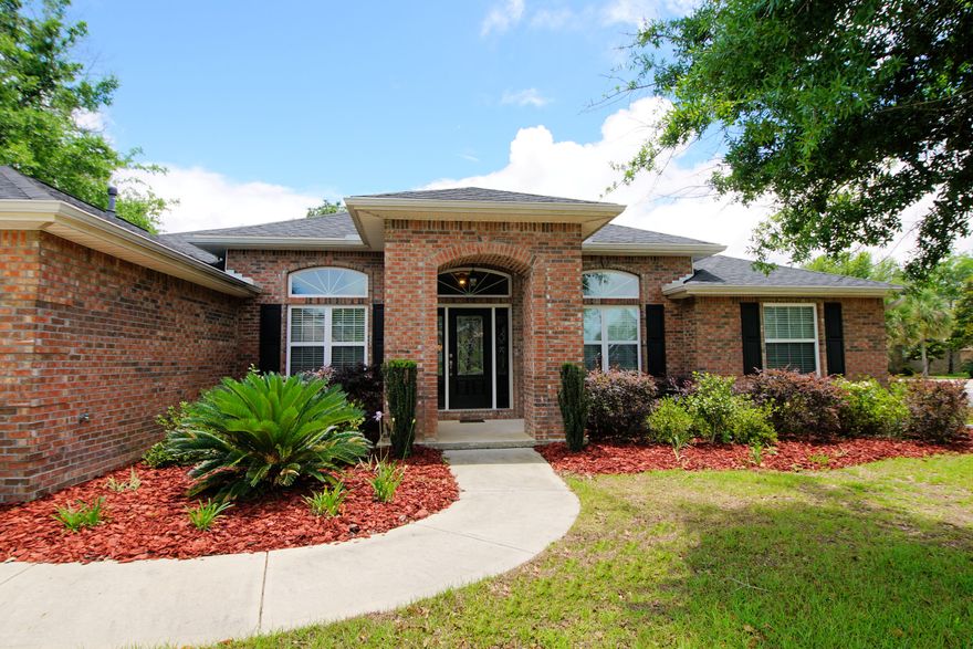 Welcome home to 4623 Chanan Drive! This 4 bed 3 full bath brick home is sitting on a corner lot with over a quarter of an acre! Crestview's only GATED COMMUNITY south of I-10 is ready for you! You will love the split floor plan which offers a large formal dining room, an office/den with french doors, and large bedrooms. Tons of storage! The light and bright kitchen has an abundance of cabinets, granite counter-tops, stainless steel appliances, large pantry, and a breakfast bar. Master bedroom suite offers tray ceiling with lighting and crown molding. Dual vanities, garden tub, separate shower, and enormous walk in closet. Enjoy your morning coffee or cool evenings on the screened in back patio. Master bedroom also has french doors leading out to the patio. Continue..