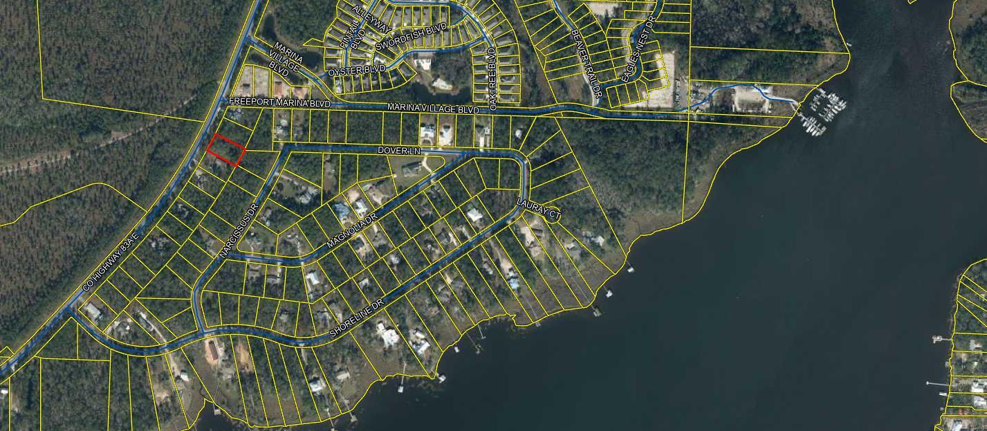Motivated Seller. 1/2 Acre beautifull heavily wooded lot on a major paved rd. Hwy E 83A (E. Bay Loop Road). Large lot to build that forever home with access to a boat launch at Marina Village Rd or 4 mile creek, then to the Choctahatchee Bay. The beautiful sandy beaches of Destin and South Walton are just a few miles away with multiple dining restaurants and entertainment.