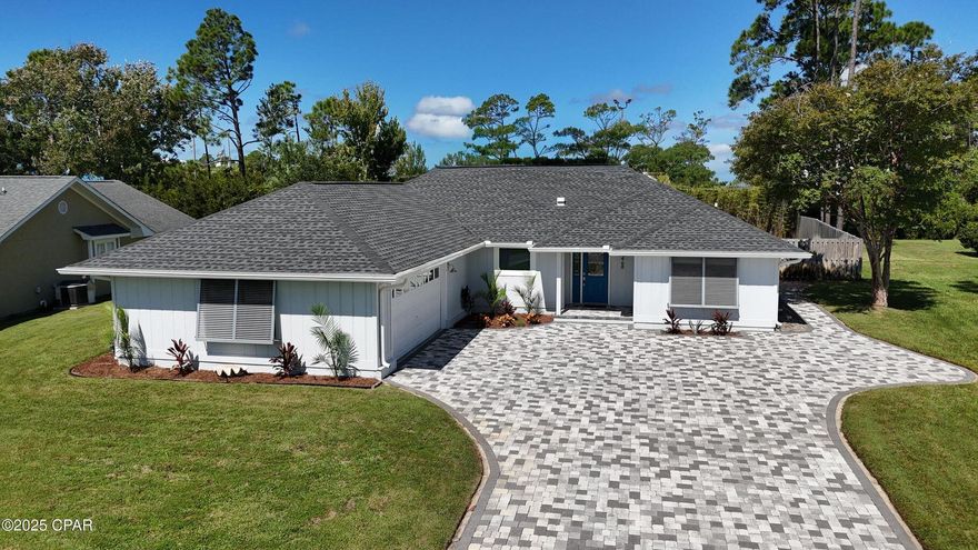 Move-in ready and waiting for you. Renovated 3BR/2BA on Wahoo Road with approx. 2,182 sq ft, paver driveway, 2-car garage, and beautifully landscaped front and back yards. Hurricane-impact replacement windows bathe the home in natural light throughout, and the guest bath features a skylight. The open living area centers on a fireplace and flows to a kitchen finished with quartz countertops throughout the home. A mudroom-style drop zone sits just off the entry, and the spacious laundry room is exactly what everyone wants for everyday convenience. The split-bedroom floor plan provides great privacy. The primary bedroom features a tray ceiling, while the ensuite bath offers double vanities, a walk-in shower, and a beautiful soaking tub, plus a walk-in closet and direct access to a screened Florida room overlooking the fenced, private backyard. Off the living room, a glass-enclosed flex room adds window seating along one wall and a second fireplaceideal as a den, studio, or playroom. Set in guard-gated Bay Point (Lot 619)a premier golf course community with canals and a full-service marina. The back gate is just a short distance from this home, putting you minutes from restaurants, beaches, and shopping.
