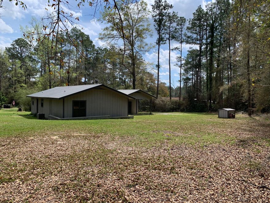 Close to everything, yet tucked away with over a half acre of privacy, this home will charm you with its brick fireplace, split floor plan and wonderful proximity to the town of DeFuniak Springs. This home could be a wonderful option if you are looking for outdoor space while still living close to town, with easy proxmity to Interstate 10. Call today for your private showing.