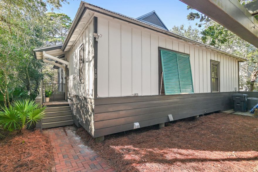 30A REFRESH! BATHROOMS REMODELED; FRESH INTERIOR PAINT AND WOOD FLOORS REFINISHED THROUGHOUT!  This coastal home is on the desirable east end of 30A with an inviting open floorplan and remodeled kitchen. The large quartz island is complemented by GE Cafe line appliances. The freshly painted woodwork in the living room and kitchen gives an airy ambiance, creating the ideal backdrop for coastal living. This home has three bedrooms and three full bathrooms, a seperate laundry room and an expansive screened in patio  with a vaulted ceiling, swinging bed, television and ceiling fan. Plantation shutters and custom woven shades adorn the oversized windows.  Outside, a secret paved garden path leading to the street adds a touch of enchantment. Outdoor shower. Owner Shed.