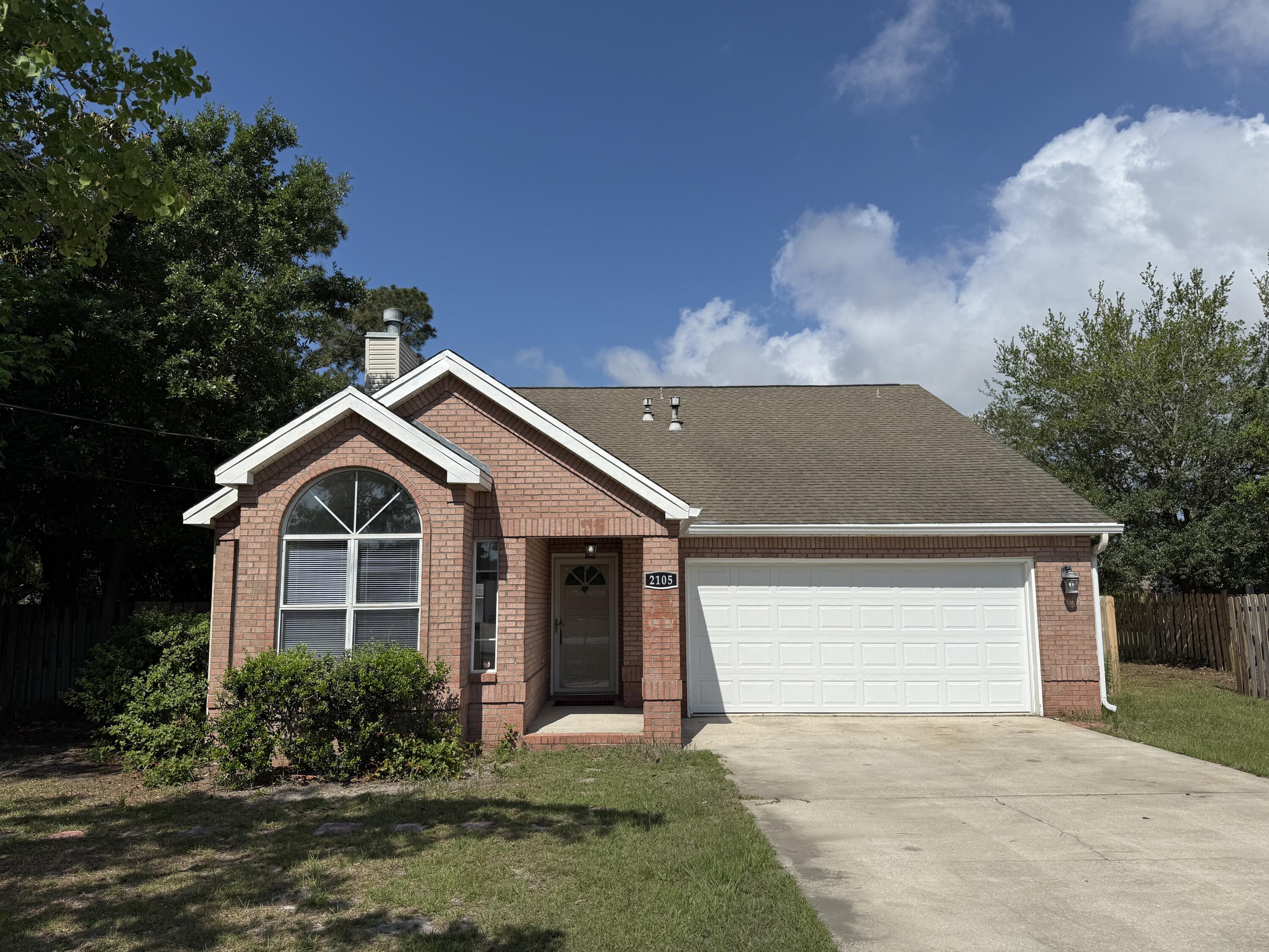 Fabulous Central Navarre Location - Less than 5 Minutes to Navarre Beach! This spacious 1,718 sq. ft., 4-bedroom, 2-bathroom home is situated on nearly a half-acre lot with no HOA, offering privacy and flexibility. The property includes an impressive 600 sq. ft. detached building with two rooms, fully insulated for use as guest quarters, a workshop, a she-shed, or a man-cave - whatever suits your lifestyle!The oversized eat-in kitchen boasts modern touches including a gas stove, built-in microwave, new wood cabinets, solid surface countertops, and generous counter space, perfect for culinary enthusiasts. The large living room features a soaring 12-foot ceiling, stylish ceiling fan/lights, ample natural light, and a fireplace with a TV mount. French doors in the living room lead to the versatile 4th bedroom (bonus room) located upstairs, which provides access to a walk-in, decked attic - ideal for abundant storage. This 4th bedroom offers the extra space every homeowner needs! The Master Bedroom is on the 1st floor, along with two additional bedrooms and two full bathrooms. The master suite features a trayed ceiling, French doors leading to a screened porch, a luxurious updated bathroom with a step-in shower, new vanity, new LVP flooring, a walk-in closet, and a private water closet. The guest bedrooms are well-sized, equipped with fan-lights and ample closet space.
The property includes a spacious laundry room for added convenience. Outdoors, the expansive backyard with a wood deck offers potential for entertaining, relaxing, or future customization. Notable for its superior build quality, the home is framed with oak and the roof structure is reinforced with 2x6's, showcasing its solid construction. Recent updates include a 2024 hot water heater, newer HVAC system, and updated septic (2024). Roof is 2006 and is in good condition. The two-car garage features one extended side to accommodate a truck. This property is a rare find with space, versatility, and proximity to Navarre Beach. Call today to schedule your viewing of this wonderful home!