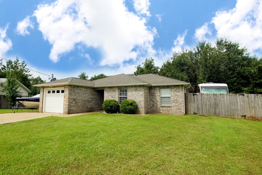 Gorgeous home with 3 bedroom, 2 baths and 1150 sq ft located Sth of I10 in Crestview, FL! This well-maintained home is close to the bases, schools, and shopping! The homeowners have added a large worshop/shed in the backyard ($6500), repaired the privacy fence and deck, replaced the HVAC, remodeled the bathrooms, updated light fixtures, and much more! There is a large concrete pad on the left side of the home perfect for boat parking! Enter the home and notice the vaulted ceilings! There is an open floor plan with the kitchen opening to the eat-in area and living room! The kitchen features a new refrigerator (2018), built-in microwave, stove/oven and dishwasher!This brick and vinyl home also features a one car garage and a large backyard surrounded by a privacy fence.