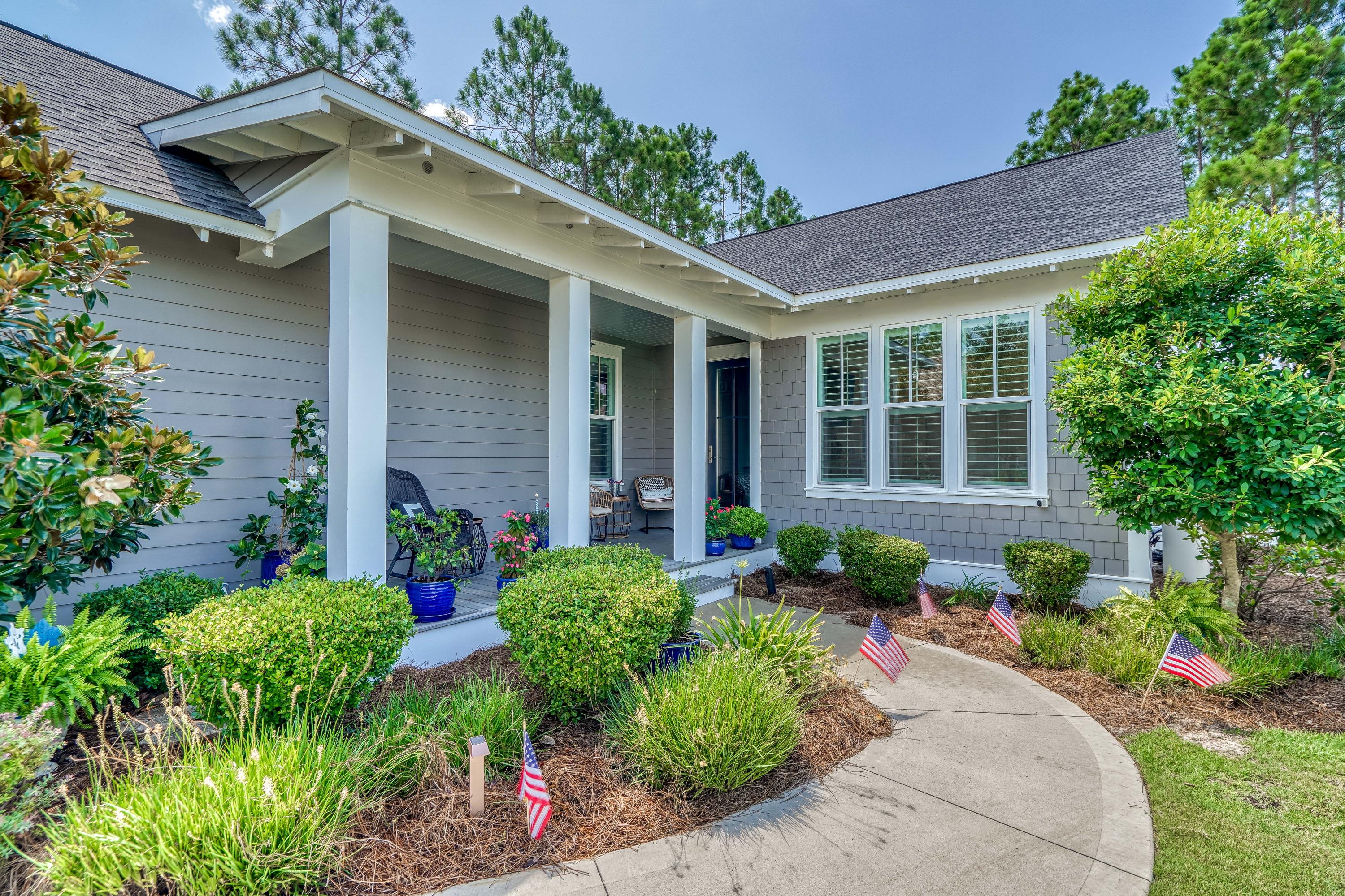Immaculate home in WaterSound Origins. Located on a premium corner lot with a picturesque gas lantern front porch and beautifully designed landscaping, this house overlooks a park with benches & gazebo and a nature trail in the back. In close proximity to the excellent Watersound amenities and a desirable Phase I location with all construction finished. This Dogwood floorplan offers 10' ceilings in main areas, crown moulding, huge master closet, open & bright living/dining layout w/ plenty windows, gourmet kitchen w/ quartz counter tops, stainless steel vent hood, custom lighting, plantation shutters throughout, upgraded bathrooms, large screened-in back porch, Gladiator shelving in garage, Nest doorbell, smoke/carbon monoxide detector, Ecobee Thermostat & surge protector on HVAC.