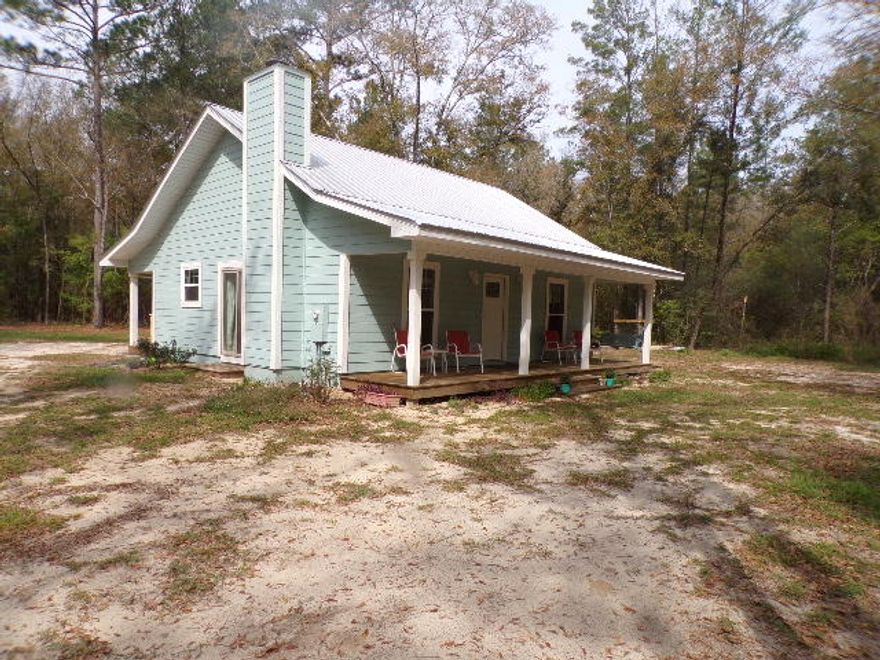 Come see this Beautiful country home on 2.5 acres of hardwoods, magnolias and ceder trees.This is Country living at its finest two year old modern home in the woods. You must come see this to believe its beauty.