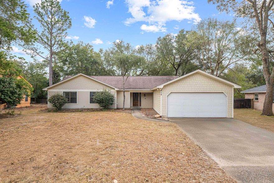 Welcome home to this well maintained and renovated ranch style home in the desired Bluewater Bay Community. Bluewater offers 3 community pools, walking paths, community golf course, and golf cart friendly community. No HOA Dues! As you enter the front door into the foyer you will notice the beautiful LVP Flooring, vaulted ceilings with wood beam, fireplace and large living area. The renovated kitchen and eat-in area feature stainless steel appliances, French door fridge, breakfast bar, granite counters, white cabinets, and subway tile backsplash. Lots of light with skylights and recessed lighting. Off the kitchen you will find the laundry room/built-in pantry and garage access. New interior door knobs, sink and bathroom fixtures through out. The formal dining room features trey ceiling, chair rail and is open to living area. The oversized living room showcases wood-beam vaulted ceiling and tiled wood burning fireplace with custom tiled flooring. French doors lead to the additional living area at the back of the home. This "Florida room" is great extra space for a game room, office, playroom, etc. or just watching the backyard nature scenery. All three bedrooms have an ensuite bath! The primary bedroom is a dream come true with LVP flooring, a large 10x16 flex room/office/gym/nursery, two large walk-in closets, and primary bathroom with double vanity, garden tub, new towel racks and walk-in shower. Primary closet has new retractable blind and flex area has new light blocking retractable blinds. The other two bedrooms both feature walk-in closets too. The backyard features a Paver Patio with a covered area and plenty of room for outdoor play and entertaining. Several trees were removed, limbs trimmed and freshly landscaped. Smart irrigation system with rain detector. There is also a metal shed for additional storage at side yard. Ring cameras, ring doorbell and smart thermostat remain.  All important systems are updated and include HVAC system and duct work along with a REME HALO Air Purifier in 2018. Exterior painted in 2021. New water heater, electric range and dishwasher in 2020. The LVP Flooring and carpet in bedrooms was installed in 2020. The roof was installed in 2014. The fridge in the garage, newer washer, and dryer also convey with the home for buyer's convenience. The shed conveys ASIS. Termite Bond with Bryan's Pest Control and bait stations. This home is move in ready! 