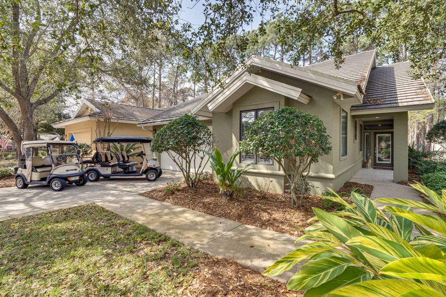 Incredible opportunity to own a lovely single level home in one of the areas most desirable neighborhoods. Very tastefully decorated, crisp, clean, and well maintained residence features comfortable living spaces, ample square footage, two car garage, and privacy, and this unique offering is move in ready. The open floor plan is anchored around the kitchen, living area, and dining room and provides for easy entertaining. The split bedrooms promote privacy between the spacious master suite and guest suites, each of which have their own en suite full baths. This beautiful home is located in a short term rental restricted neighborhood and is being offered partially furnished and includes two golf carts, most guest room furnishings, dining area table and chairs, and desk. Excellent choice