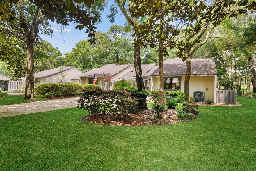 Exceptionally private patio home in Blue Water Bay. As you step into the fully private courtyard you will see the private outdoor spaces this home has to offer. This home features over 1,400 sq.ft. of living area including the Florida room. Vinyl and Tile floors throughout. There are 2 additional private patio areas overlooking and exceptional nature filled wooded area. New high efficient heating and air w/special filters. Washer and dryer convey. High top and chairs in front courtyard, Murphy bed and built in shelving and electric fireplace also convey. Own a piece of Blue Water Bay!