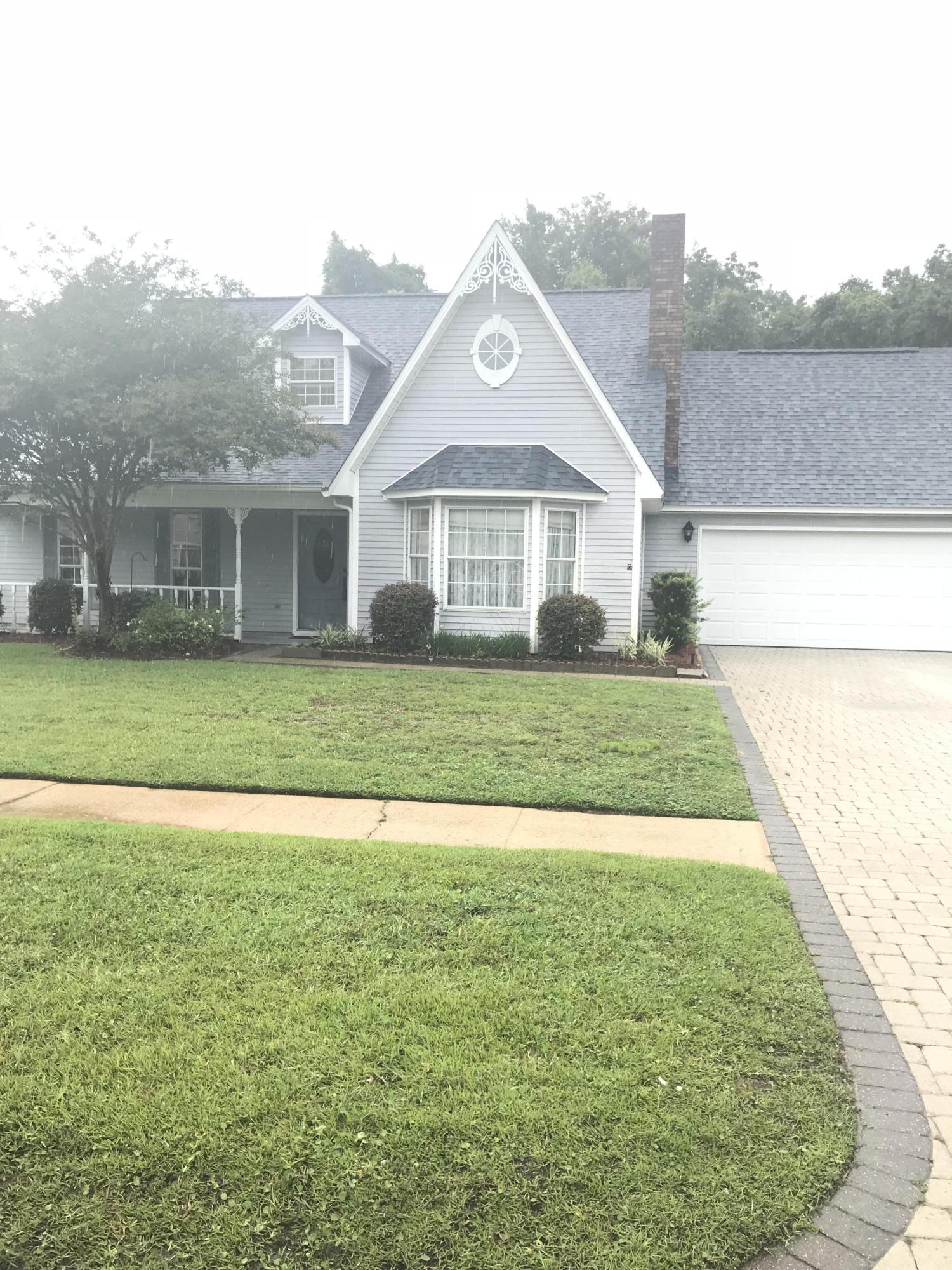 Great location close to both bases and shopping. NO HOA! 4 bed/3 bath home in Mary Esther! This 2200 sq. ft. property was a true custom build and a one-owner property. This home has a large living room with decorative sunlight, large beams in the spacious front room with vaulted ceiling, and brick fireplace, not to mention recessed lighting and a spacious dining/kitchen combo with lots of cabinet space and tons of countertop room for cooking and prep. There is a laundry area in the garage just off the kitchen. A big bonus loft greets you at the top of the stairs overlooking the front room with yet another bonus room just off the loft area that could be used as a fifth bedroom if desired. New carpets just installed. Backyard surrounded by privacy fencing. There is a neighbor park and lake.