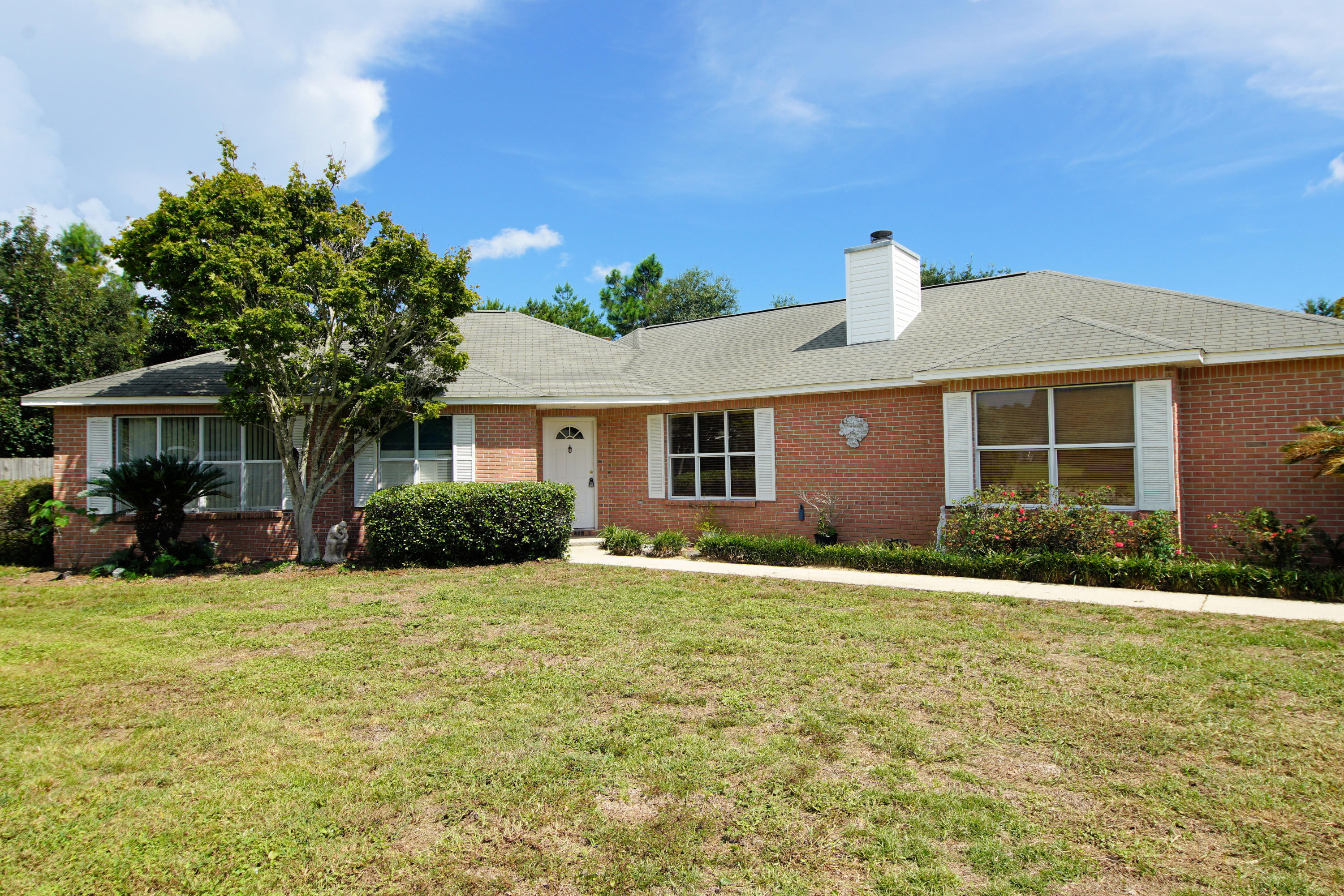 Tons of charm in this all brick home located in the quaint neighborhood of Robledal Estates, a picturesque bayfront subdivision with water access! Freshly painted and new wood plank tile throughout! This unique floorplan is sure to please, featuring two living areas each with its own fireplace! All three bedrooms are generously sized with the master having a tray ceiling, two closets, a separate shower and whirlpool tub. Kitchen has center island, an abundance of cabinet space and built-in microwave and oven. Enjoy your evenings in the serene, ample sized backyard, complete with lush foliage and gazebo. Plenty of possibilities here! Don't let this one get away! Hot tub and shed convey as-is. Buyer to verify measurements.