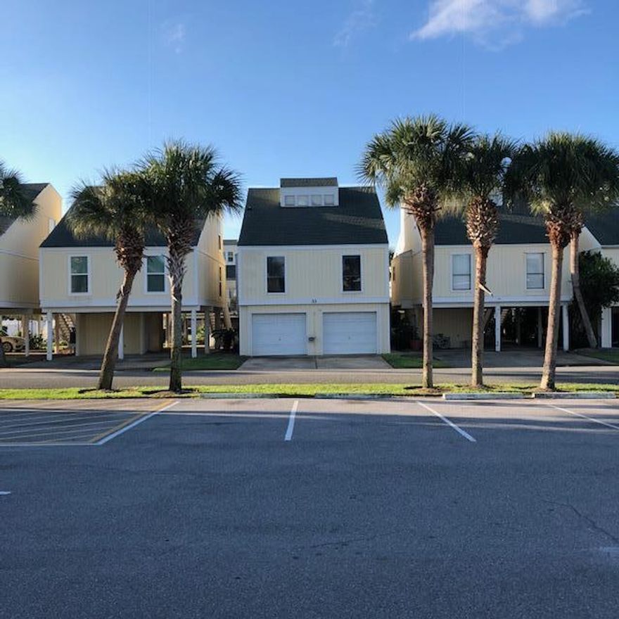 A unique Sandpiper Cove villa among the ''Courtyard Villas'' that run in two rows east of the Sandpiper Cove tennis courts -- its ground level was enclosed some years ago, creating a bunkroom studio with kitchenette and bath and laundry, and the carport area was taken in to create enclosed garage space. Upstairs is the regular 3-bedroom / 2-bath floorplan. These freestanding detached houses sit right in the middle of the harbor side of the Sandpiper Cove tract, particularly convenient to the 1000-ft. boat canal and the 6 tennis courts but also the 9-hole pitch-and-putt golf course and in easy walking distance to the beach. Cross the street to the beach using the Sandpiper Cove pedestrian-controlled traffic signal ... Seller financing ... Condominium Association: $2,664.71 + $294.78/quarter