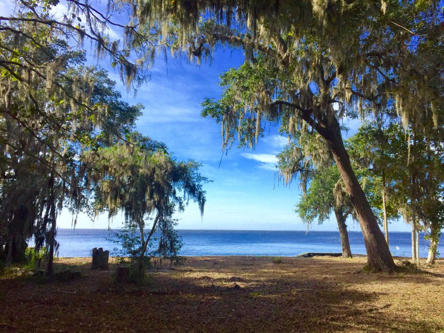Lots 3 & 4 of The Oaks have been assembled to sell as one lot, creating one of the most unique bay front properties in all of Burnt Pine. This beautiful home-site has several majestic oak and magnolia trees and offers spectacular sunset views over Choctawhatchee Bay. This lot is located conveniently close to shops and restaurants in Grand Blvd and The Village of Baytowne Wharf. Sandestin features 4 golf courses, a 93 slip marina, tennis courts, and much more.