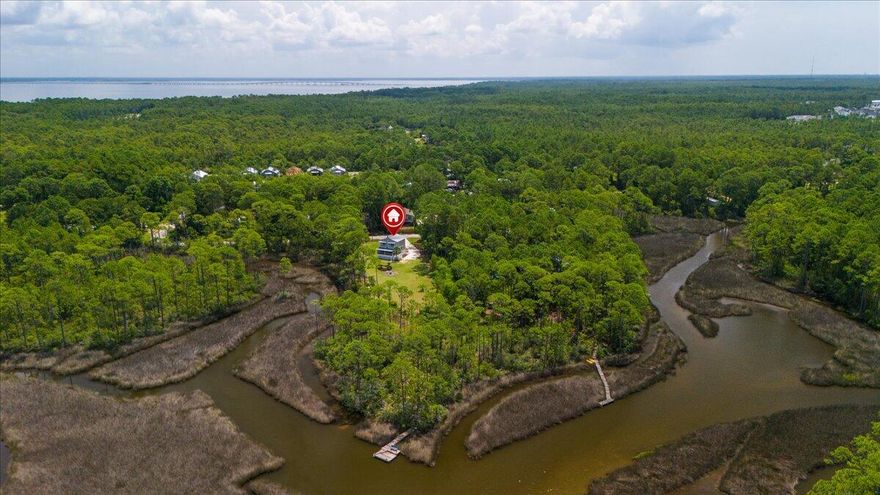 Private Bay View Retreat w/ Balconies, Screened Porch & Canal Access Welcome to 190 L Street, a beautifully remodeled coastal retreat tucked away in the peaceful bayfront community of Santa Rosa Beach. Renovated in 2023, this charming 3-bedroom, 2.5-bath home offers 1,152 square feet of thoughtfully designed living space with stunning bay views and direct canal frontage. Wake up to serene water views from both the primary suite and second bedroom, each featuring private balconies perfect for morning coffee or sunset unwinding. The main living level opens to a spacious screened porch, creating the ideal space for relaxing, entertaining, and enjoying the coastal breeze. Set on a large lot for the area, the property offers privacy while embracing the laid-back coastal lifestyle that makes Santa Rosa Beach so special.

Located just minutes from Cessna Landing Park and waterfront dining at The Bay, this home is perfectly positioned for those who love life on the water. Launch your kayaks or paddleboards directly from the canal in your backyard and spend the day exploring the bay. The beach and the world-famous 30A corridor are only about 10 minutes away, giving you quick access to white sand beaches, dining, and shopping while still enjoying a quiet retreat. With room for boat or RV parking, potential space for a pool, and additional lots available that could expand the property to nearly 0.7 acres, this is a rare opportunity offering flexibility, privacy, and strong investment potential in Santa Rosa Beach. Short-term rentals are allowed, making this property ideal as a primary residence, vacation home, or income-producing investment.
