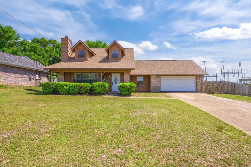 Tucked away on a spacious half-acre lot just off Mobile Highway in Pensacola, this one-of-a-kind property offers the perfect blend of charm, function, and outdoor living. The standout features begin outside: a large backyard complete with a pool surrounded by a deck--ideal for entertaining or relaxing in your own private oasis. There's also a separate concrete driveway leading to a covered carport designed to fit a boat or RV with ease, plus a shed for all your extra storage needs. The exterior gives off cozy cabin/cottage vibes, welcoming you home with warmth and character. Inside, you'll find 3 bedrooms and 2 bathrooms thoughtfully arranged for both comfort and style. The living room is a true focal point, boasting a soaring stone fireplace and a large window that floods the space with  natural light. The oversized window sill is a dream for plant lovers or anyone who enjoys a sunny nook to read or relax. The kitchen has a neutral palette with granite countertops, stainless steel appliances, and ample cabinet space. A breakfast bar and separate dining area are convenient for meals and gatherings. The downstairs primary suite features two closets and an ensuite bath with a tub/shower combo and spacious vanity. Upstairs are two additional bedroomsone with views of the pooland a stylish full bathroom with modern finishes. Rounding out this unique home is a two-car garage with direct access to the laundry room, making for a convenient mudroom-style entrance. It's rare to find a property in Pensacola that offers this much character, charm, and versatile features like RV/boat parking and a pooldon't miss your chance to make it yours!