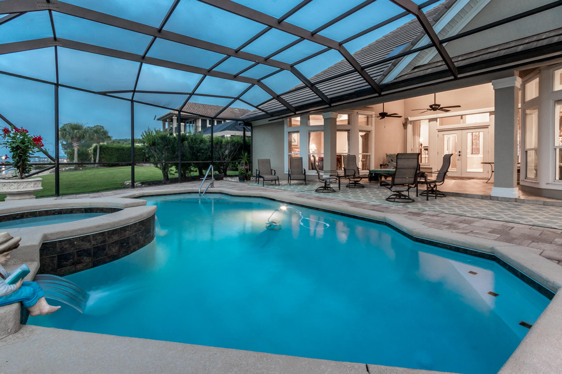 Custom-built bayfront retreat with saltwater pool, boat dock and first-floor master suite on 100' of prime water frontage delivers endless views of the Choctawhatchee Bay at every turn. This single-owner home is pristine and impeccably maintained. An enclosed lanai with heated, saltwater pool, hot tub and well-appointed summer kitchen provides year-round use and stunning design to the home's shoreline. A soaring ceiling, ornate chandelier and large arched window at the home's entry set the tone for the entire house. Handcrafted bow windows gently curve outward to maximize views and allow sunlight to reach deep within the interior. The kitchen is uniquely spacious and well equipped with custom cabinetry, granite counters, paneled refrigerator, warming drawer and island with vegetable sink.