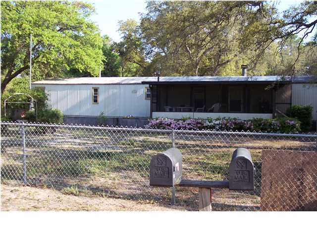 The property has two mobile homes on it- one is a two BR two BA and one is a two BR one BA. The pool is situated in the center of the two homes with a screened in patio.The homes have screened in porches. There are two storage units on the property and one garage. The units are currently rented . Home A is 924 SF and unit B is 636 SF. The living room, kitchen and dining area are in one area making it an open living space. There is a breakfast bar the separates the area. Buyer to verify SF. 924 SF andd 636 SF in the mobile homes. Property is sold ''AS IS''.Seller has a pool service and pays the water for the property. I have called the county and per Growth management: the property can build 6 homes per acre/ 8 units per acre for duplex/ 16 units per acre for townhomes/ and 16 units