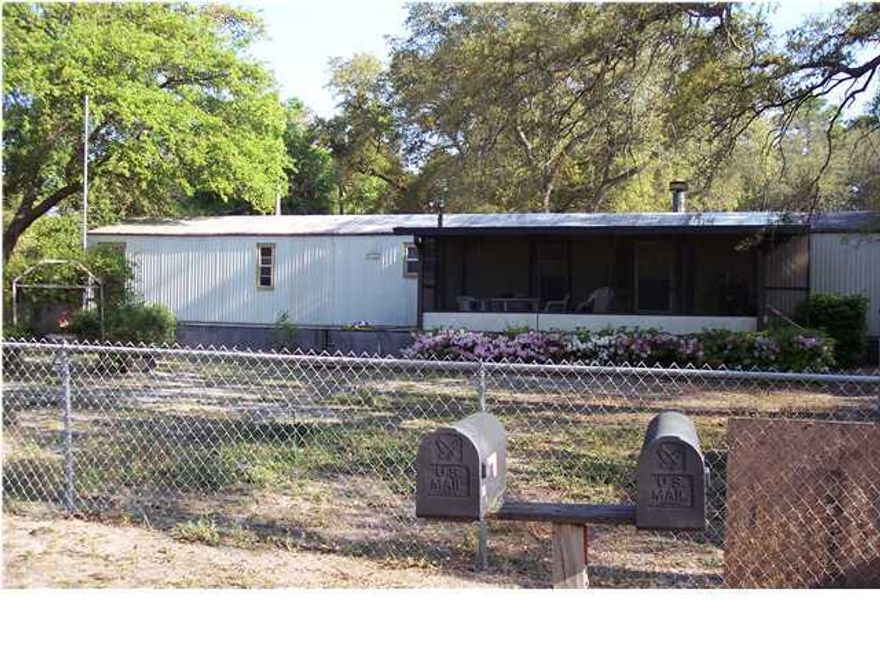 The property has two mobile homes on it- one is a two BR two BA and one is a two BR one BA. The pool is situated in the center of the two homes with a screened in patio.The homes have screened in porches. There are two storage units on the property and one garage. The units are currently rented . Home A is 924 SF and unit B is 636 SF. The living room, kitchen and dining area are in one area making it an open living space. There is a breakfast bar the separates the area. Buyer to verify SF. 924 SF andd 636 SF in the mobile homes. Property is sold ''AS IS''.Seller has a pool service and pays the water for the property. I have called the county and per Growth management: the property can build 6 homes per acre/ 8 units per acre for duplex/ 16 units per acre for townhomes/ and 16 units