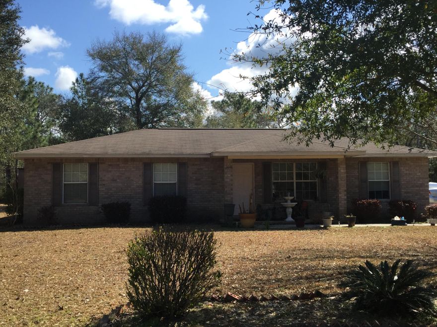 An All Brick 1326 sq. ft. 3 bedroom, 2 bath Home on larger than a half acre lot. Home features: Great Room, Dining Area with sliding glass door leading to the spacious outdoors. The home sits on a large mostly natural lot extolling the greatness of Mother Nature. Get the feel of country-living at a great price. The yard building conveys AS IS.