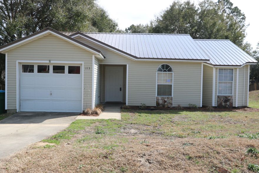 Rare find in South Crestview is convenient to bases and beaches. The home features a new metal roof and AC unit. When you step inside this inviting home you'll find tile flooring flowing through the living room and kitchen as well as vaulted ceilings. The big master bedroom boasts a large closet which is a rare find in a home this size. Just out the back door is a great place to grill or simply enjoy morning coffee on the covered deck. This home is ready for it's new family.
