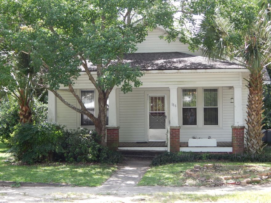 Charming home built in the Historic District of Defuniak Springs FL, just one block from Lake Defuniak. The home was built in 1900 and pride was taken throughout the years in caring for this home. The home features all original pine wood tongue and groove floors and walls throughout, ten foot ceilings, and two fireplaces. This three bedroom, one bathroom with original claw-foot bathtub also features a small shower. Home comes furnished with antique beds and furniture. This craftsman home has maintenance free vinyl siding, a new 30-year dimensional roof (2014). Home has a wonderful front porch for your rocking chairs, nicely landscaped with palm trees and large oaks, and small out building. Located in historical district, walking distance to restaurants and antique stores.