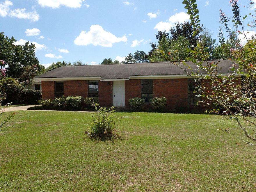 Opportunity knocks with this REO property! Off Auburn Rd and easily accessible by either Airport Rd or Hwy 85, this 4 bedroom 2 bath home has all brick exterior, chain link fenced back yard and rests on 1 acre. Home has a combination of tile floors and some carpet. Originally a smaller home, the home has had some additional square footage added creating an extra bonus room/bedroom. Home needs work and therefore will not qualify for all types of financing. Call today to set up your showing!