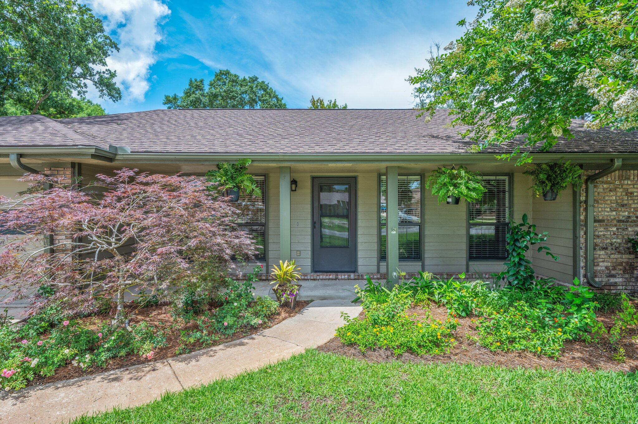 Welcome to this beautifully maintained and professionally landscaped home. It is centrally located in the heart of Niceville. Don't miss this one! All the major systems are updated, and the seller is offering up to $10,000 ''any way'' money, perfect for covering closing costs or buying down your rate.The front porch welcomes you home and as you enter, the foyer opens to the dining room, front office, and open concept kitchen/family room. It's that perfect combination of separate but open. The spacious owner's suite includes an office/ sitting room that looks out to a butterfly garden. The ensuite bathroom features dual vanities, a deluxe walk-in shower, private toilet room, and walk-in closet. Two additional comfortable bedrooms share a well-appointed hall bath. The kitchen includes ample counter space, pantry with custom shelving, gas stove, and brand-new refrigerator and dishwasher. It opens to the family room where there's plenty of space to gather and you'll never be far from the action of the kitchen or sunroom. You'll love the sunroom - it's an oversized, light-filled space ideal for entertaining or simply enjoying the view year-round through large picture windows. The laundry room is conveniently located off the kitchen and includes a door to the backyard.
Outdoors, you'll find a true oasis with a large patio, pergola, fire pit, and room for loungers. Every window onto this backyard is a treat, with a different view of the beautifully designed space. One side of the home features an inviting path and the other side includes a blueberry bush and a fig tree near a double-wide gate. Beyond the gate, there's a versatile side yard perfect for storing kayaks or adding a raised-bed garden.
Just minutes from top-rated schools, shopping, parks, military bases, and the stunning Emerald Coast beaches, this home offers both comfort and convenience.