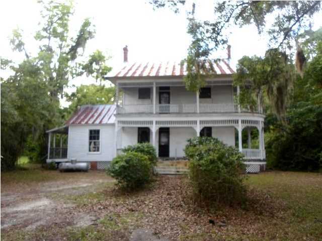 Any one that has spent anytime in Freeport knows about this home. Located just South of downtown and across from the port of Freeport this Victorian home sits on over 2 acres. It was built is 1900 and possesses all of the old world charm that you could hope for. The main level has 2 fireplaces, one in each of the main living areas. The master suite sits on the main floor as well. The rooms are large and the ceilings are raised. As you might imagine, the woodwork is fantastic. There are balconies and decks everywhere! The spare bedrooms are on the second floor. Both are large and one has a bonus room attached. There is endless potential but it needs work. The right buyer will convert this beautiful home into a masterpiece!