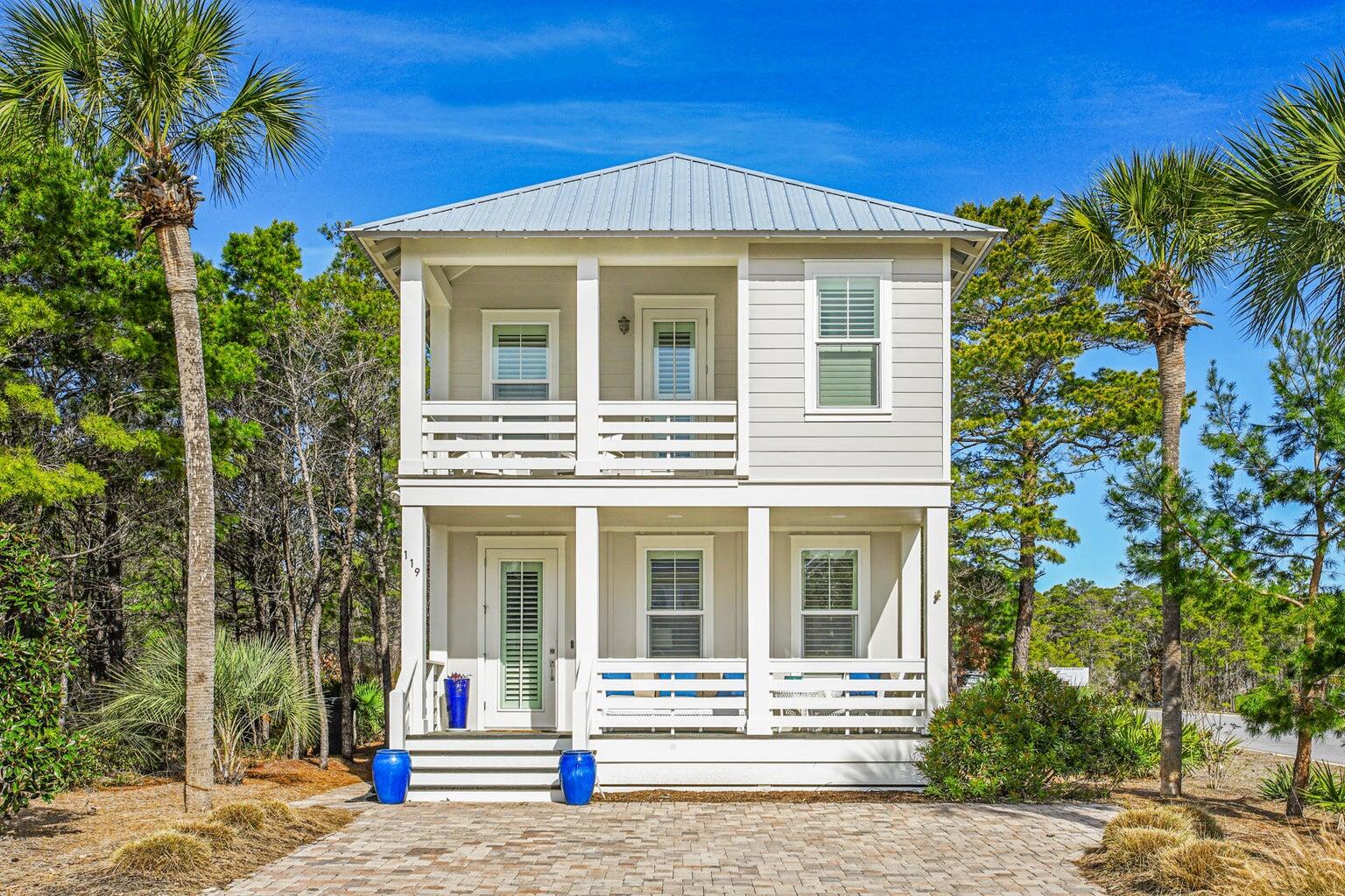 Minutes to the Beach. This beach cottage sits on a corner lot with plenty of room for a back yard accent pool. It is being sold fully furnished and rental ready. Built in 2016 and meticulously maintained. The floor plan is open with modern coastal finishes and fresh upscale furniture. The main floor offers living, dining and kitchen as well as half bath, laundry and one master suite. The second floor offers another master suite with private porch along with 2 additional bedrooms and a shared bath. Special features include multiple porches, rear patio, a golf cart garage. The kitchen is ready to entertain with upscale counter tops and newer stainless steel appliances .Shadow Pines is a charming neighborhood with lighted streets, private community pool.