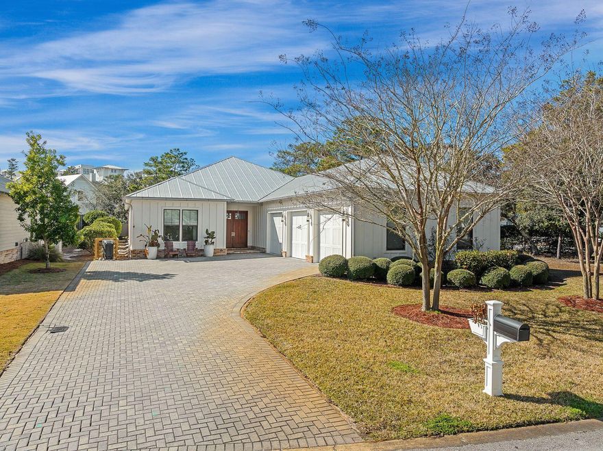 This quintessential coastal home boasts four beds, three baths and a rare three-car garage. Sitting on an oversized corner lot, it has a huge outdoor living ''room'' with a brick-built gas fireplace and a private heated pool beneath a screened mansard roof. It's a private oasis designed for entertaining and enjoying an outdoor lifestyle. A sweeping paved driveway leads up to the garage and the custom front door of this craftsman-built home. Clean contemporary interiors and custom lighting create a bright and relaxed open living space that immediately makes you feel at home. Large portrait windows allow natural light to bounce off the hardwood flooring that is featured throughout the property. The chef's kitchen is adorned with custom cabinets and appliances while shiplap accents and and repurposed beams add unique designer accents. The granite-topped island is the natural hub of the home for socializing and casual dining. It sweeps around and easily seats four at the elegant curving edge. A walk-in pantry and wine refrigerator complete the appeal. Laid out all on one level, hardwood flooring flows seamlessly onward to include a formal dining area lit by a stunning glass light fitting. Four spacious bedrooms and three immaculate bathrooms continue the highest standards of luxury in this private retreat. All this enviable living space is just a short stroll from the breathtaking white sand and shimmering Gulf of Mexico that Seagrove Beach is known for. When it comes to dining, boutique shopping and live entertainment, there's nowhere better than neighboring Seaside, Florida, WaterColor Town Center and Grayton Beach, all just a short walk or bicycle ride away.