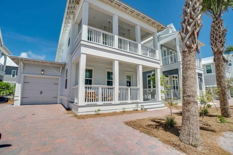 Desirable Panama floor plan in one of the only homes in the community that enjoys both views of the Gulf, and of the neighborhood resort-style pool. Located on the southernmost street in Prominence South, and just a short stroll to the Beach Club, this home will generate over $130K in 2022 making it a perfect second-home or investment property! Interior features include hardwood flooring, 10-foot smooth-finish ceilings, 2 Master Suites, 8 foot interior doors, upgraded shiplap details, custom built-in bunks, and a cool coastal color palette throughout. The open floor plan on the first level allows guests to seamlessly interact whether they are enjoying al fresco dining on the expanded paver patio, preparing a meal in the kitchen, or socializing in the living area. Located off the kitchen