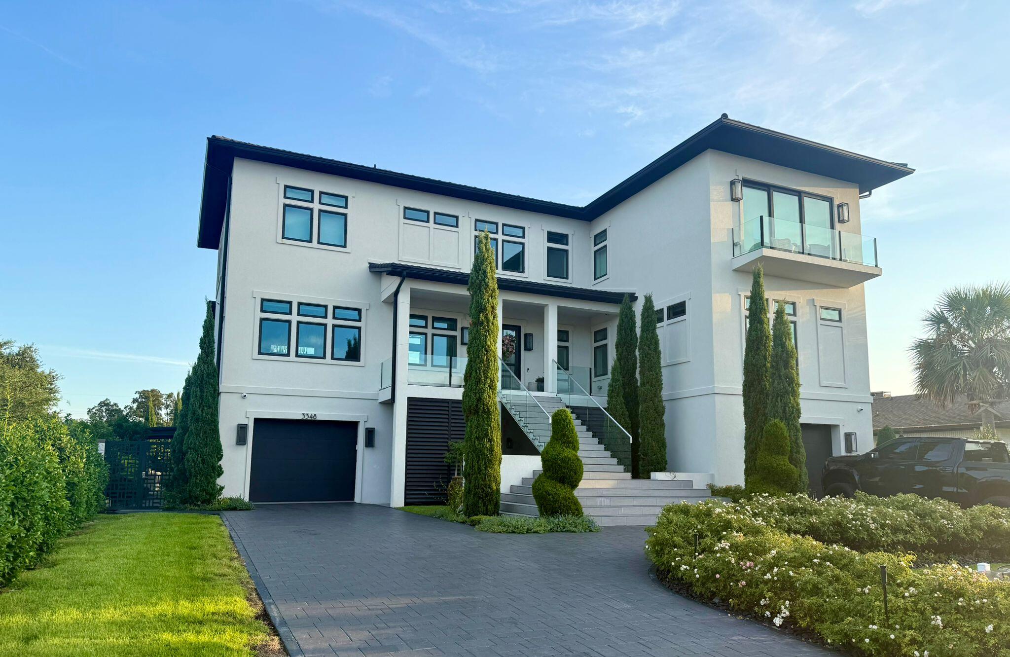 Spectacular Luxury Contemporary House Located Steps from Tiger Point Country Club in High end Neighborhood , Estate Built to Withstand HurricanesExperience unmatched elegance, innovation, and security in this extraordinary ICF-constructed home, specifically engineered to withstand hurricane-force winds. Nestled along the prestigious Intracoastal Waterway, this architectural masterpiece boasts breathtaking water views from all 56 oversized windows, setting a new standard for coastal living.🏡 Construction & Exterior FeaturesSolid ICF (Insulated Concrete Form) construction ensures superior strength, insulation, and storm resistanceDistinctive Mediterranean-style metal roof for longevity and aesthetic appealFully enclosed with an affordably fortified brick privacy fence
