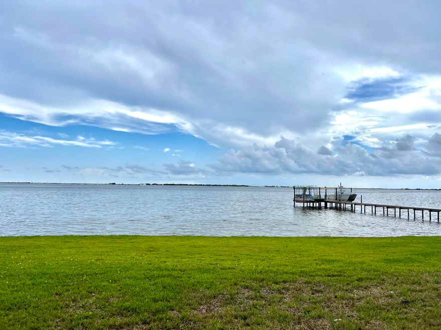 BACK ON THE MARKET! No fault to the seller! Amazing Views! The house is positioned to capitalize the beauty of the sound and Santa Rosa Island with expansive water views and beautiful white sand dunes. Majestic old oaks occupy the 1.22 acres as well as a rambling creek under a canopy of trees. Enchanting property. THE VIEWS are simply WOW with 100 ft of waterfront, and a 3 1/2-mile water view.  The house also has a 5-car attached garage, chef's kitchen w/gas range and multiple ovens, original mid-century terrazzo floors, amazing ceilings. The flood insurance is assumable. Parking pad for RV w/ hook-ups. Original Brick patio provides additional charm. The homes has been updated with a number of the original features