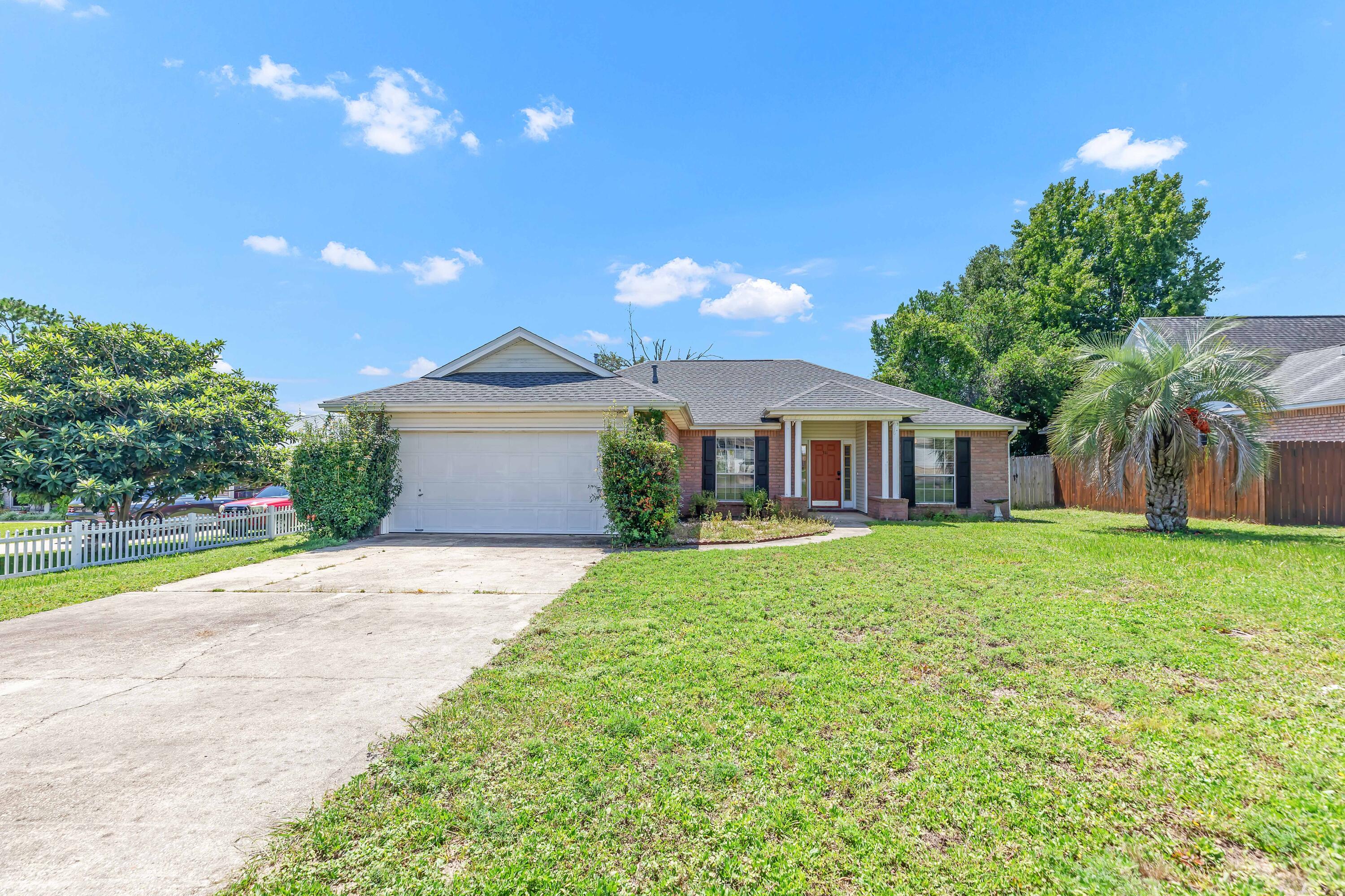 Welcome to this charming all-brick home, offering comfort and convenience in a prime location! Step inside to an open-concept layout featuring tall ceilings, a cozy wood-burning fireplace, and a formal dining area perfect for gatherings. The split floor plan provides privacy, with the master suite boasting a double vanity, garden tub, and walk-in closet. Enjoy the outdoors year-round from the screened-in back porch, overlooking a large, flat yard--ideal for play, pets, or entertaining. Practical updates include a 2021 roof for peace of mind. Nestled at the end of a quiet cul-de-sac, this home offers low traffic and added privacy, while still being just minutes from local schools, hospitals, shopping, and dining.