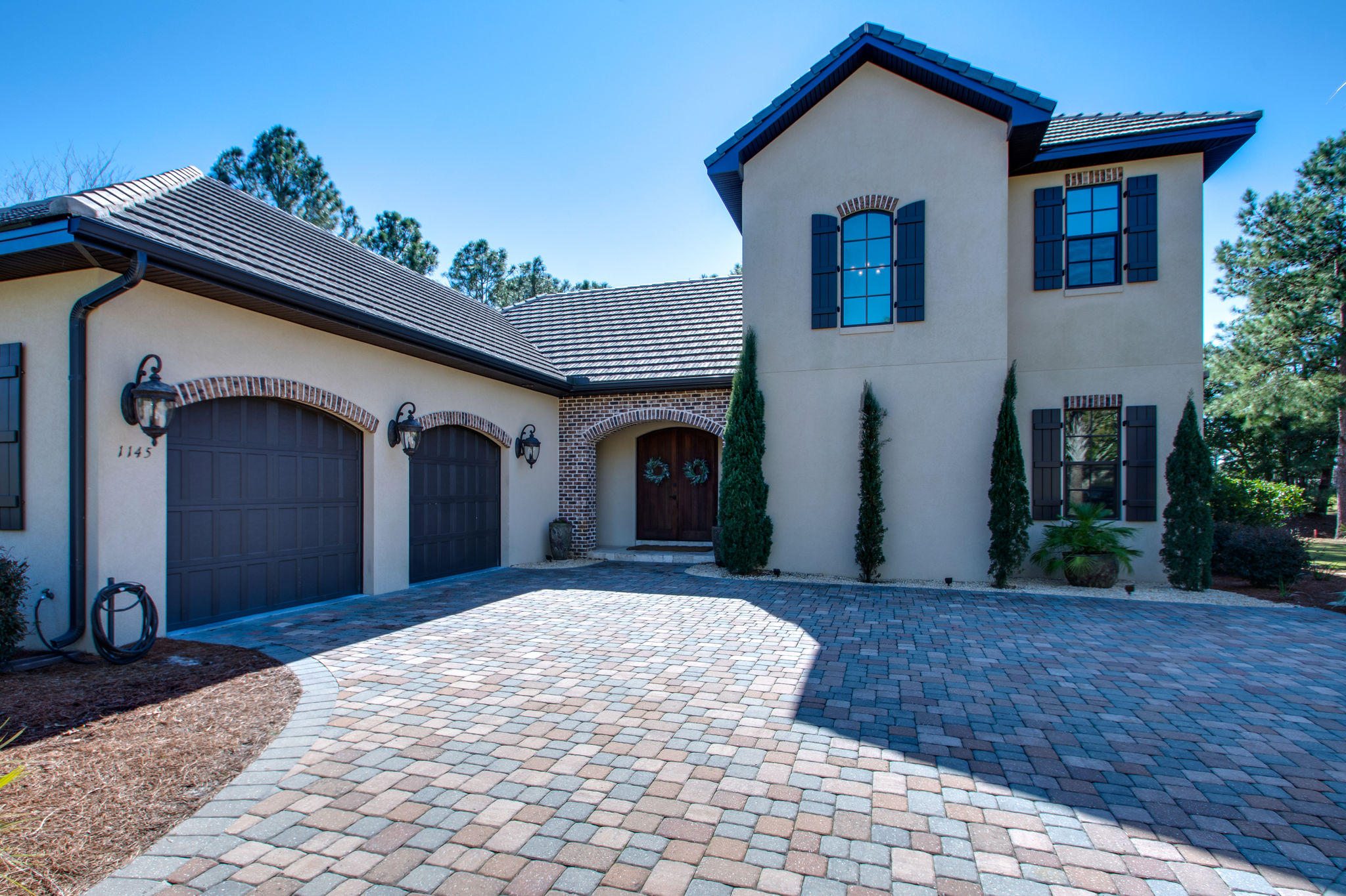 Stunning custom built Huff Home is perfectly situated facing the Baytowne/Raven Clubhouse, and adjacent to Baytowne #18.. This home has both waterfront and golf views for those who want it all. From the lovely arched front door to the beautiful crown moulding, and spacious interior, you will be awed with it's gracious appeal. The home has a beautiful custom gourmet kitchen with gorgeous granite and cabinets accented by quality Electrolux stainless steel appliances. The custom granite island has seating for three and a roomy pantry is available for that discriminating cook. You will have wonderful water views from both the many living area windows or from your own nicely landscaped back yard. All Measurements are approximates and buyer needs to verify