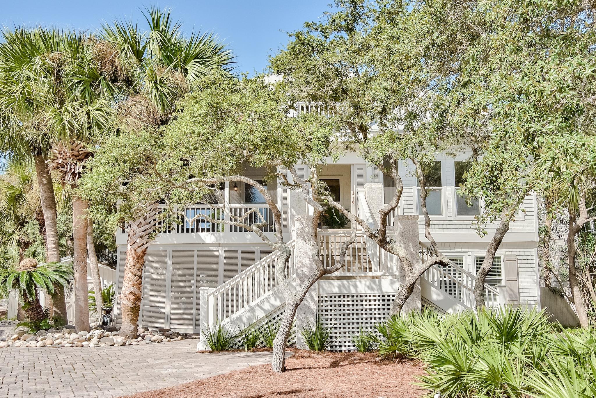 380 Walton Rose Lane is the quintessential Inlet Beach home, nestled on a massive estate size lot just two minutes from the sugar white beaches of the Gulf of Mexico. It has been completely renovated with all new exterior paint, interior paint, resurfaced and tiled salt water pool, completely remodeled kitchen, all bathrooms have been completely updated, along with a stunning new master bath suite accented with marble finishes, separate double vanities, stand-alone tub, separate marble walk-in shower, and new fixtures throughout. This 4-bedroom 3-bath home is the perfect full-time, second, or investment income producing home. When walking up to Walton Rose Lane you a greeted with a beautiful coastal design stairway up to the second floor where the home has a massive vaulted wrap around screened in porch. As you enter the home there is a large open kitchen, dinning with pecky cypress ceiling, and open living surrounded with windows on to the porch to give you the feeling of tree house living. The second floor has 2 bedrooms with a full bath. Off the large wrap around porch is access to the true beauty of this home the large lush backyard is truly a unique oasis. The backyard is completely fenced with a lush side yard for activities, animals, families, or even just friends to enjoy outdoor fun! Not to mention the backyard is accented with a large salt-water pool, dining area, and stunning fireplace area for everyone to gather on those starry beach nights. This home is truly one-of-a-kind and is prominently located just steps from Rosemary in Inlet Beach. Please do not miss the opportunity to view this home, buyer to verify all dimensions.
