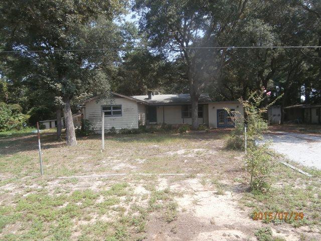 REO ~ Opportunity Knocks... 2 Homes on a Large Lot in Shalimar. The main home is 3 Bd / 2 Ba & the second home is 1 Bd / 1 Ba perfect for guest quarters or rental opportunity. Great location close to Eglin AFB. Don't miss out on this great opportunity.