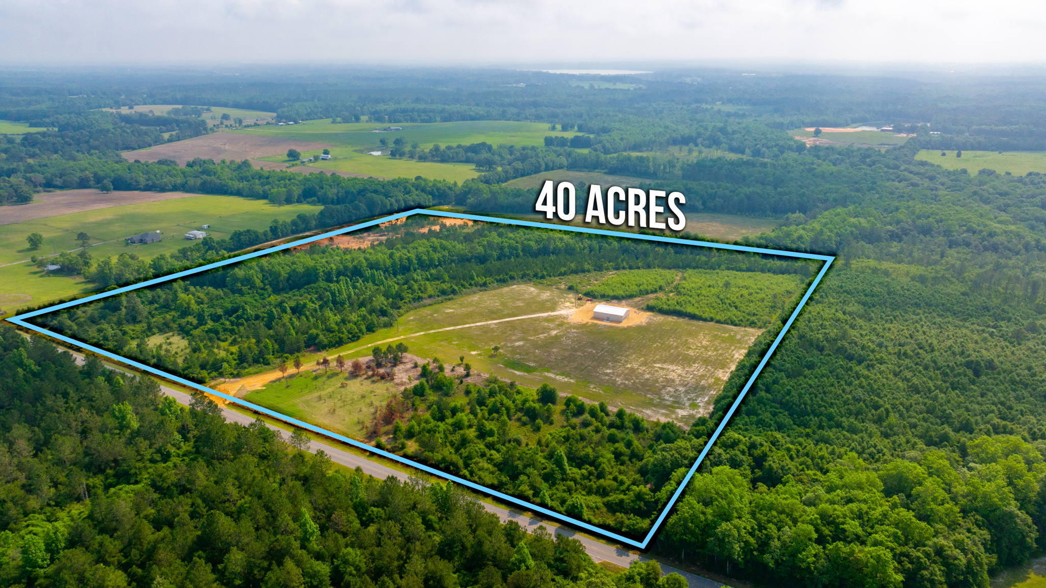 Located in beautiful NORTH Walton County this 40 acres has EVERYTHING and is located on a paved road with over 1320 feet on road frontage. This property offers a beautiful gate entrance that leads you to the 40x60 barn that includes a bedroom and bath and tons of storage and opportunity to finish out to make a home or weekend getaway. Property is wooded with cleared areas - just minutes to amazing Lake Jackson for fishing and convenient to Eglin AFB as well as commuting to Crestview! Dream property awaits!