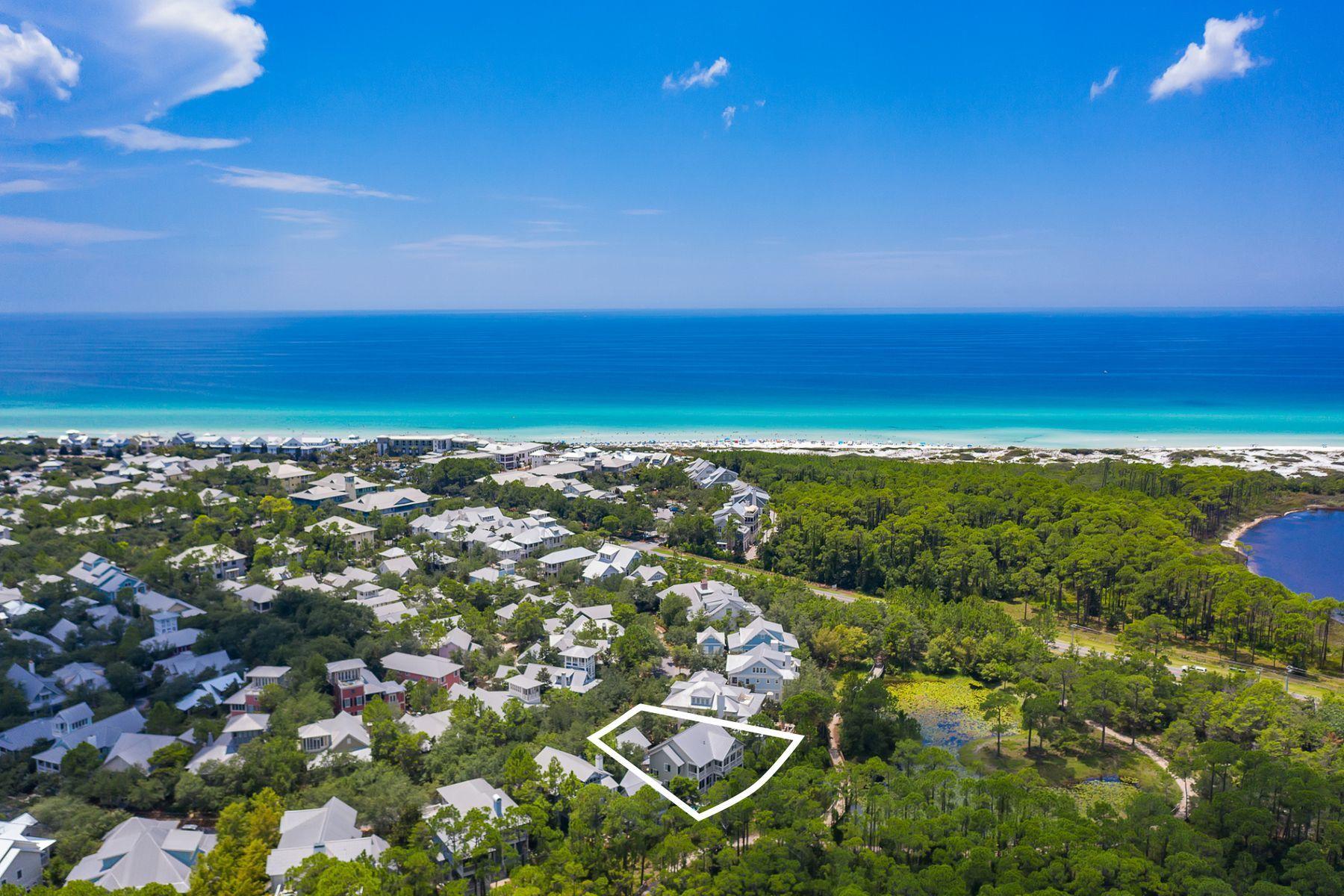 Prime positioning maximizing beautiful lake views paired with a handsome architectural facade characterize this Watercolor Phase 1 retreat optimally positioned to enjoy close proximity to the new Watercolor Beach Club. Recently updated, this beautiful home includes five bedrooms and five & one half baths including a spacious detached carriage house as well as a two car garage with an oversized parking court. Notable features include a first floor master suite with an oversized ensuite bathroom including direct access to the rear screened lanai and recently built private resort pool. The first level also offers two additional sleeping spaces as well as a beautiful foyer entryway with two staircase access points leading to the main living areas of the home.