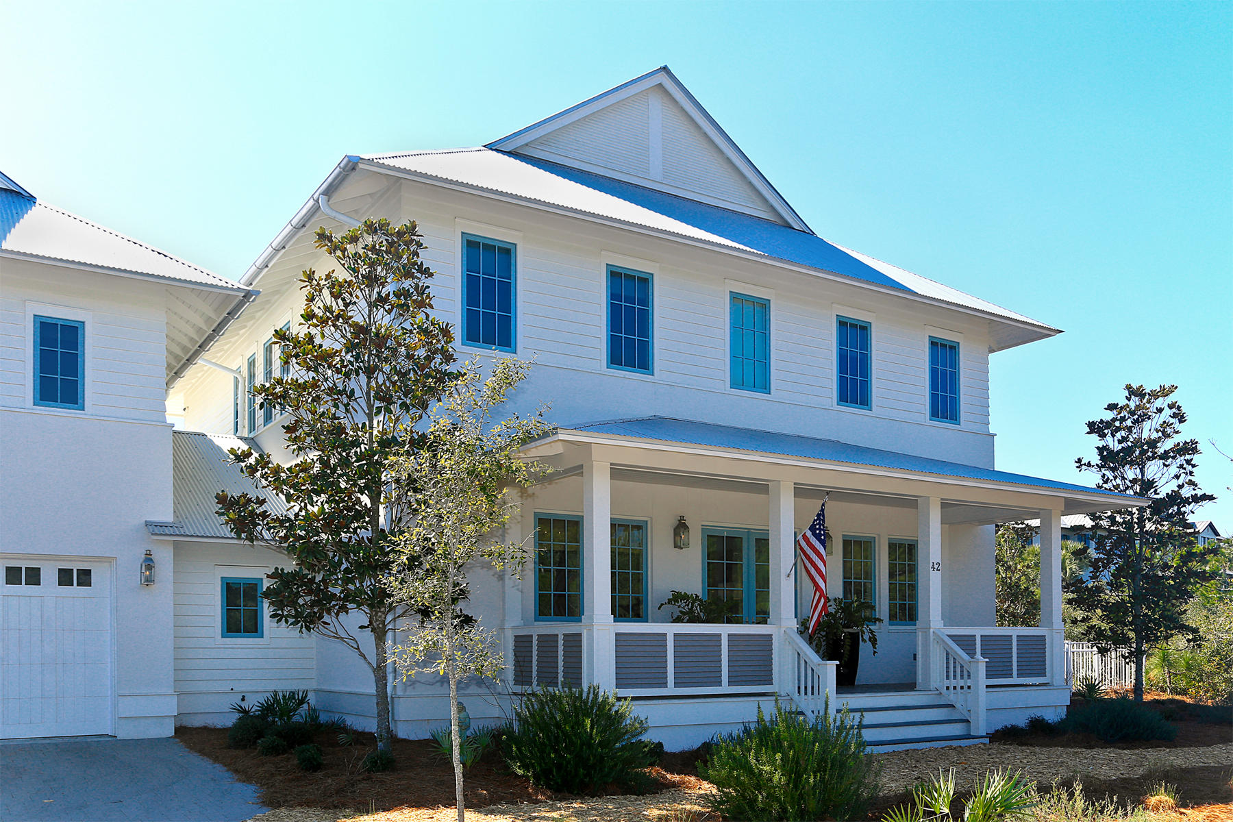 Luxury abounds in this Santa Rosa Beach home in the exclusive, gated community of The Retreat. Completed in 2014 to the highest specifications, this lavish residence creates a wonderful first impression with full width porch across the front of the house. The two story carriage house has its own self contained suite including a dining, kitchen, living room, king-size master and bunk room. In the main residence, polished wood flooring graces the formal dining area beneath the central staircase. No less impressive is the family sized kitchen showcasing pristine white cabinetry with panel doors, stainless steel appliances and island dining. Muted grey and white dcor throughout creates a calm ambiance, not least in the convenient first floor master bedroom.