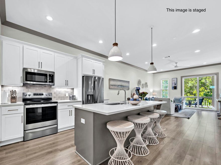 Experience the perfect blend of luxury, location, and lifestyle in this beautifully Unfurnished 3-bedroom, 2-bath condo on the desirable west end of 30A--just 450 yards from the sugar-white sands of the Gulf! Built in 2021 by a respected local builder, this modern coastal retreat is part of an intimate low-density community of only 19 residences and boasts projected rental income of $89K.Step inside to soaring 10-foot ceilings, luxury vinyl plank flooring, and an open, light-filled layout highlighted by full-height sliding glass doors. The sleek, all-white kitchen will impress with quartz countertops, Shaker cabinetry, subway tile backsplash, and stainless steel appliances. A spacious island with seating for four provides the perfect gathering spot for family and friends.

The open-concept living and dining areas flow seamlessly to a private, full-length balcony overlooking a peaceful lakeideal for morning coffee or relaxing at sunset.

Accommodations include three generous bedrooms, featuring a custom-built bunk room with four bunks and a private primary suite offering balcony access and a spa-like bath with walk-in shower.

Enjoy the best of 30A living with two nearby public beach access points, a resort-style heated pool and hot tub, and close proximity to Topsail Hill Preserve, Point Washington State Forest, Gulf Place, Grayton Beach, and Seaside.

Whether you're looking for a personal beach retreat or a high-performing vacation rental, this turnkey condo delivers coastal style, strong income potential, and unbeatable location.