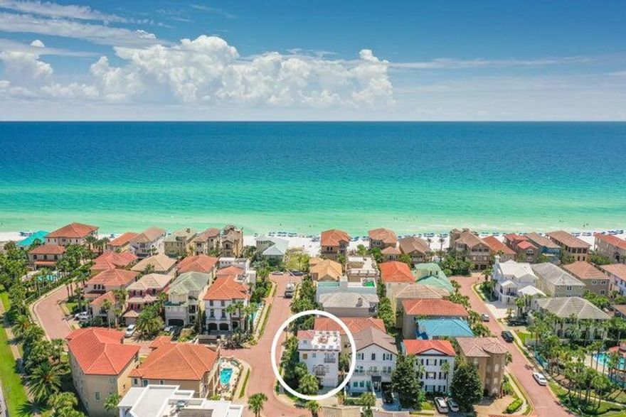This exceptional home, located within the prestigious gated community of Destiny by the Sea, sits on a desirable corner lot just 250 feet from the neighborhood beach access and 150 feet from the community pool. Thoughtfully updated, the home now features all-new exterior doors, high-impact UV-protected windows, a brand-new roof, a whole-house water filtration system, and newly refinished exterior stucco, and this is just the beginning.The first floor includes an enclosed garage and a guest bedroom with a full bath and walk-in shower. On the second floor, the spacious main living areas are centered around a welcoming gas fireplace. The kitchen, designed for both function and style, boasts an expansive island breakfast bar, stainless steel appliances--including  a gas range, vent hood, refrigerator, and dishwasherand elegant overhead cabinetry. French doors from both the living and dining areas open onto charming Juliet balconies, enhancing the open and airy feel of the space.

The third floor is home to the luxurious master suite, complete with its own gas fireplace. The master bath features a large walk-in shower and double vanity, while French doors lead to a private balcony with stunning Gulf views. An additional guest bedroom on this floor offers its own spacious walk-in shower.

Crowning the home is the spectacular rooftop deck, the perfect space for entertaining while taking in breathtaking panoramic views of the Gulf. Whether enjoying morning coffee or watching the sunset, this space offers an unparalleled coastal experience.

Residents of Destiny by the Sea also enjoy access to over 1,700 feet of private beachfront, making this home the perfect retreat for those seeking luxury and tranquility by the shore.