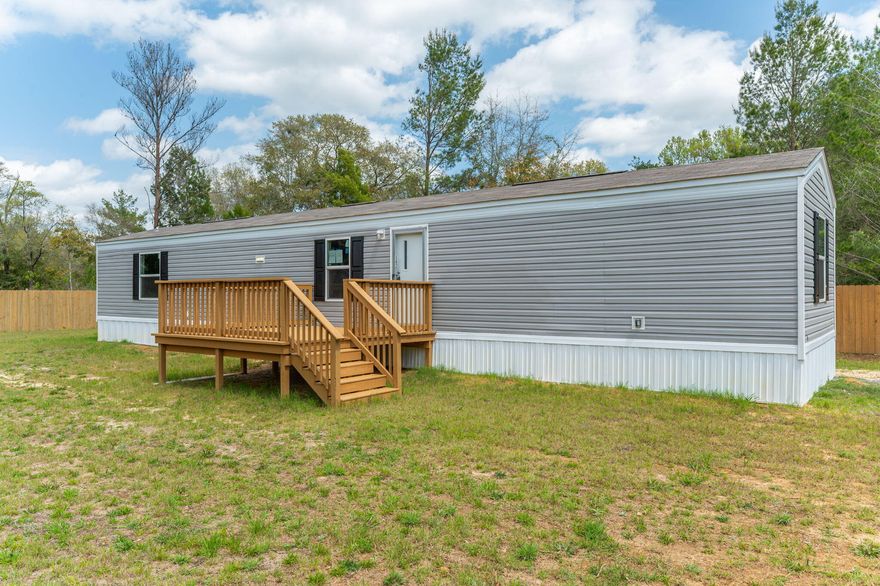 Discover this brand new mobile home in Defuniak Springs, FL. Perfect for first-time homebuyers, this charming 924 sqft residence offers 3 BD and 2 BR in a practical designed for modern living. Step outside to enjoy your morning coffee on the new front deck,. Just a short drive to beautiful Florida beaches and Airforce bases, this home balances peaceful living with accessibility to attractions and employment centers. The thoughtfully designed primary bedroom provides a peaceful retreat while the entire property delivers value and comfort without compromise. Why rent when you can own this move-in ready home with all the essentials for starting your homeownership journey? Schedule your viewing today!Options to help with closing cost assistance with approved credit through various lenders.