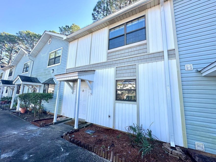 Charming, updated, and move-in ready adorable and affordable 2-bedroom, 1.5-bath townhouse ideally located in the heart of Mary Esther with convenient access to Hurlburt Field and Eglin Air Force Base. This light and bright home features an open floor plan with updated flooring throughout, modern cabinetry, and a functional layout perfect for everyday living. The kitchen is well-equipped with a newer range and dishwasher and flows seamlessly into the living and dining areas. A high-impact patio door adds both style and security while leading to a private patio--ideal for relaxing, grilling, or creating a cozy outdoor retreat. Enjoy low-maintenance living close to parks, shopping, dining, beaches, and everything Fort Walton Beach and Destin have to offer. Whether you're a first-time buyer, downsizing, or seeking a smart investment, this well-located Mary Esther townhome is a fantastic opportunity.