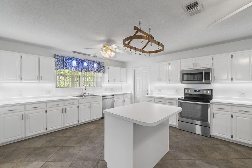 Welcome to 2365 Tumbleweed Drive, located in the heart of Holley by the Sea and just minutes to the community golf course, local schools, shopping, and Navarre's famous white-sand beaches. This sought-after neighborhood offers one of the best amenity packages along the Emerald Coast with a low annual HOA fee. Enjoy access to the multi-pool recreation center, tennis courts, pickleball, fitness rooms, sauna and steam, fishing pier, boat launch, playground, and RV parking area -- all included.This spacious home offers nearly 3,000 sq. ft. of living space on over a half-acre, fully fenced with mature trees providing natural shade and privacy. The backyard is wide, open, and perfect for a future pool, pets, play, gardening, or entertaining. A storage shed conveys as-is and includes the hurricane shutters, wooden ladder, gray metal shelving, extra kitchen tile, and additional flooring for the dining room and primary bedroom  all staying for new owners.

Inside, the home features one of the largest kitchen layouts available in this floor plan, offering generous cabinet storage, expansive counter space, and room to gather. The roof is approximately 5 years old, the home is on sewer, and it is not located in a flood zone, so no flood policy is required. A termite bond with Southwind is currently in place and may be transferred to the new buyer for peace of mind.

This is one of the best values on the market for buyers seeking space, land, amenities, and community lifestyle. Get more square footage and a larger yard for your investmentall in a highly desirable Navarre neighborhood.

Professional interior photos coming soon as the sellers are in the process of packing.

Please reach out with any questions or to schedule your private showing soon. 

Approximate date of going active as mid November. You'll definitely want this one to be on your wish list!