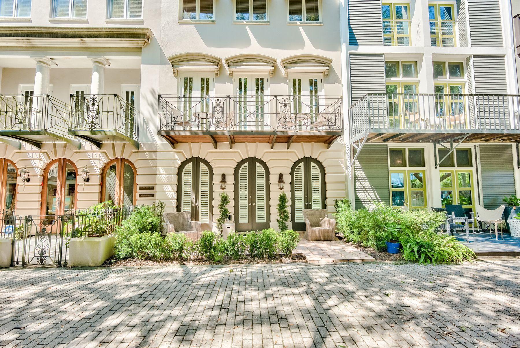 TAKING BACK UP OFFERS. Located in Ruskin Park, this is a rare opportunity to own a tranquil, coastal retreat in the heart of Seaside, Florida. Thoughtfully designed, the home features exquisite architectural details, crown molding, high ceilings, and oak floors. Two covered parking spaces, a bunk room, and a living area can be found on the first floor, along with a spacious owner's suite. The owner's suite features built-in cabinetry, and French doors lead out to a patio overlooking the park. A spiral staircase leads to second-floor living spaces, including an updated kitchen and open living area. Two additional bedrooms and bathrooms are located on the third floor, while a tower and rooftop deck on the top floor offer scenic views of Ruskin Park and nearby gulf waters. l
