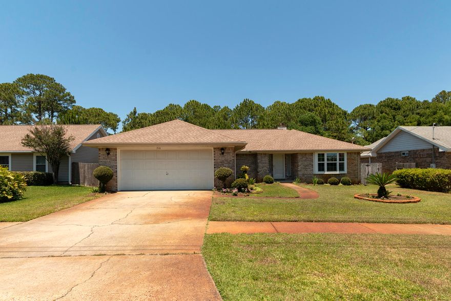 Amazing 3BR/2BA Brick Home with in-ground swimming pool and no association. Located in the heart of town, this home is close to everything Destin has to offer. Entering the home, you are greeted by a large living space with vaulted ceiling and a wood fireplace. The kitchen is large with black granite countertops, updated cabinetry, stainless appliances, & large breakfast bar. The master bedroom is nice sized with private access to the pool, updated bathroom, and large walk-in closet. There are also two additional bedrooms, laundry room, and an updated full bath. The fenced backyard is large with a nice sized swimming pool, deck, and screened patio. Other features include a 2 car-garage with additional storage room/workshop area. Don't miss out on this beautiful house.