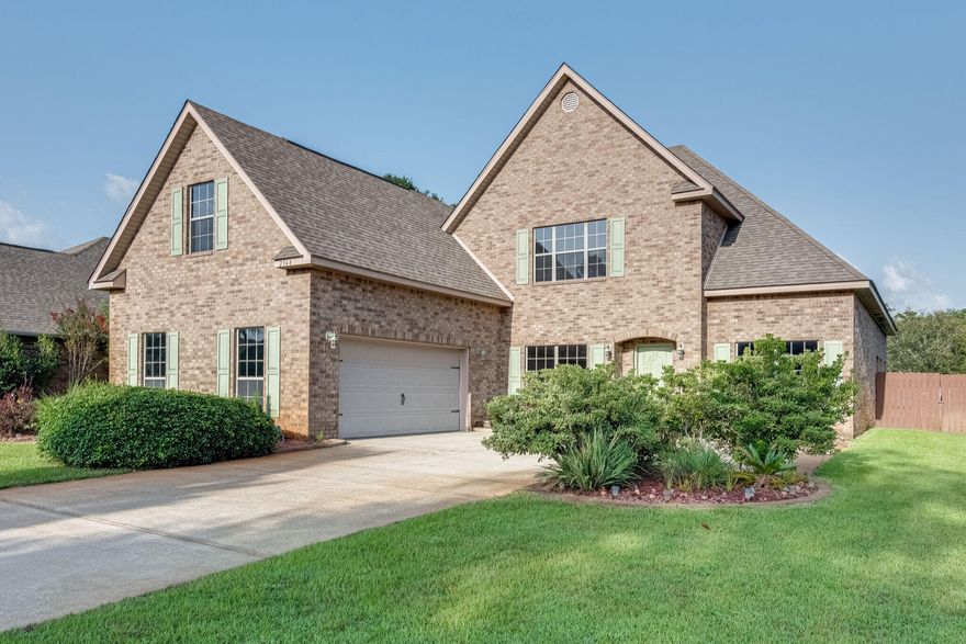 There is plenty of room in this impressive 4 bed. 3.5 baths 2 story all brick home. Fantastic open floor plan The kitchen features granite counters, staggered cabinets and pantry. Breakfast bar over looks the living area that boast octagon trey ceiling. The crown molding and trey ceiling are a nice addition to the master suite. This stunning home also features an office, formal dinning room, multiple walk in closets  and laundry room. New wood flooring compliment the second story with oversized bonus room and an additional bedroom with full bathroom. Enjoy the outdoor living with a built in kitchen inside the screened  in lanai. Fenced yard  with irrigation system and a great large shed. Home is equipped with security system and tinted windows. Come join this great high and dry subdivision that offers a community pier, sidewalks and street lamps. Minutes to our sugar sand beaches, golfing, shopping and schools.