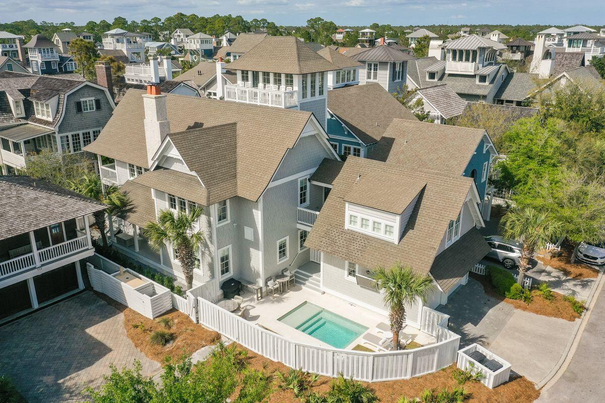 Once in a great while, an ideal location and fabulous space combine to create a truly exceptional property. Positioned one home away from the Gulf in Watersound Beach along a picturesque boardwalk, this home has been meticulously redesigned from top to bottom including the addition of a private pool, new furnishings, and updated finishes throughout. Offering main floor living, the open kitchen, dining and living area are light and bright with shiplap walls, quartz counters, wet bar, and a fabulous fireplace. The main floor has a large owner's suite with its own porch, and resort style bath with large shower, polished nickel faucets, and beautiful freestanding tub. On the 2nd level is a second owner's suite with private balcony for enjoying coffee while overlooking the boardwalk below.