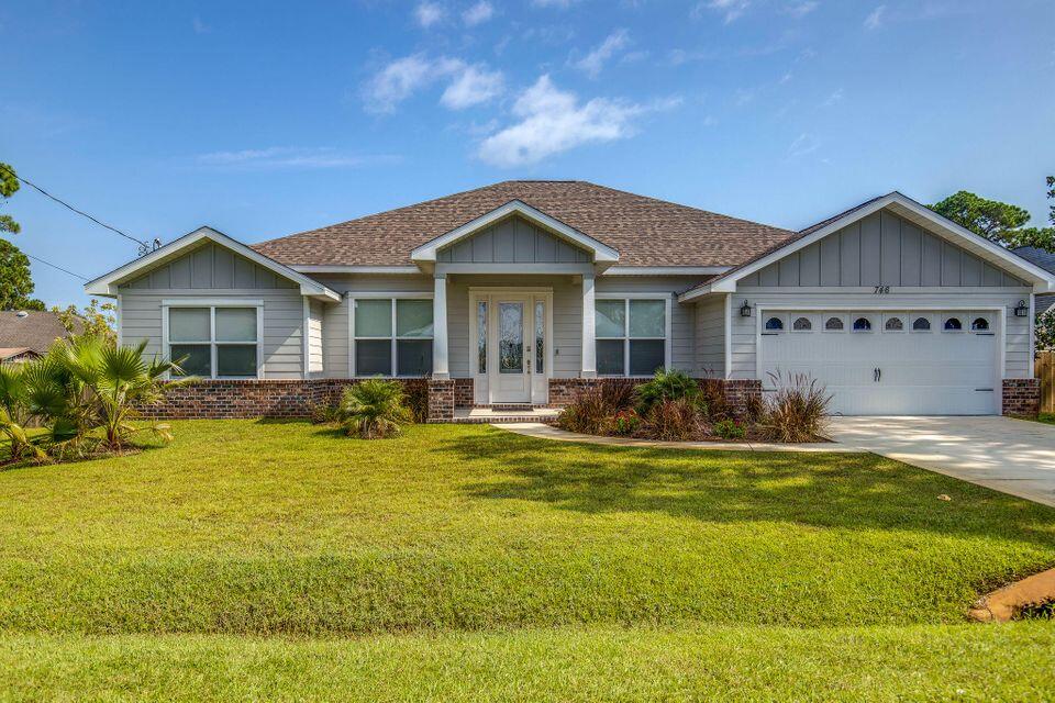 Beautiful 4br/3ba home in Miramar Beach is a short distance to everything you can imagine! Features  driftwood floors, granite countertops in the kitchen and bathrooms, and outdoor shower! French doors leading to the office, a custom barn door entrance to the private guest bedroom and bath, and soft close drawers on all cabinets. Open floor plan is perfect for families or for entertaining! Trey ceilings in master bedroom, dual sinks and a walk-in shower with seamless glass, master bath. Backyard - large enough for an oasis and playground! 1 block from the bay, minutes from the beach, surrounded by shopping, dining, and entertainment! 5 Mins to Destin and 10 mins from 30A! Boat Lunch is just around the corner!